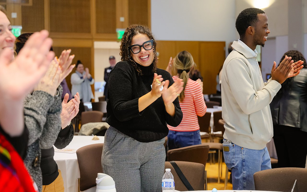 Attendees applaud at the State of the Student Conference