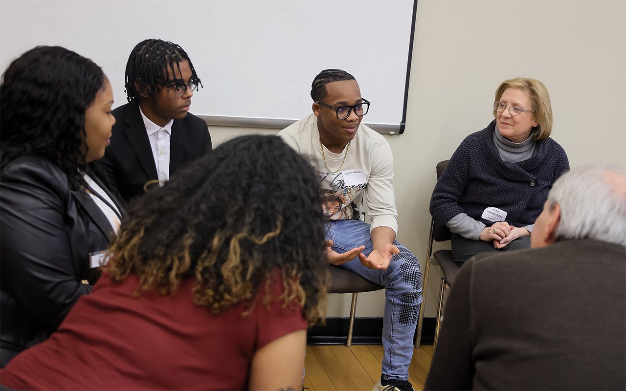 A group has a discussion during a session at the State of the Student Conference
