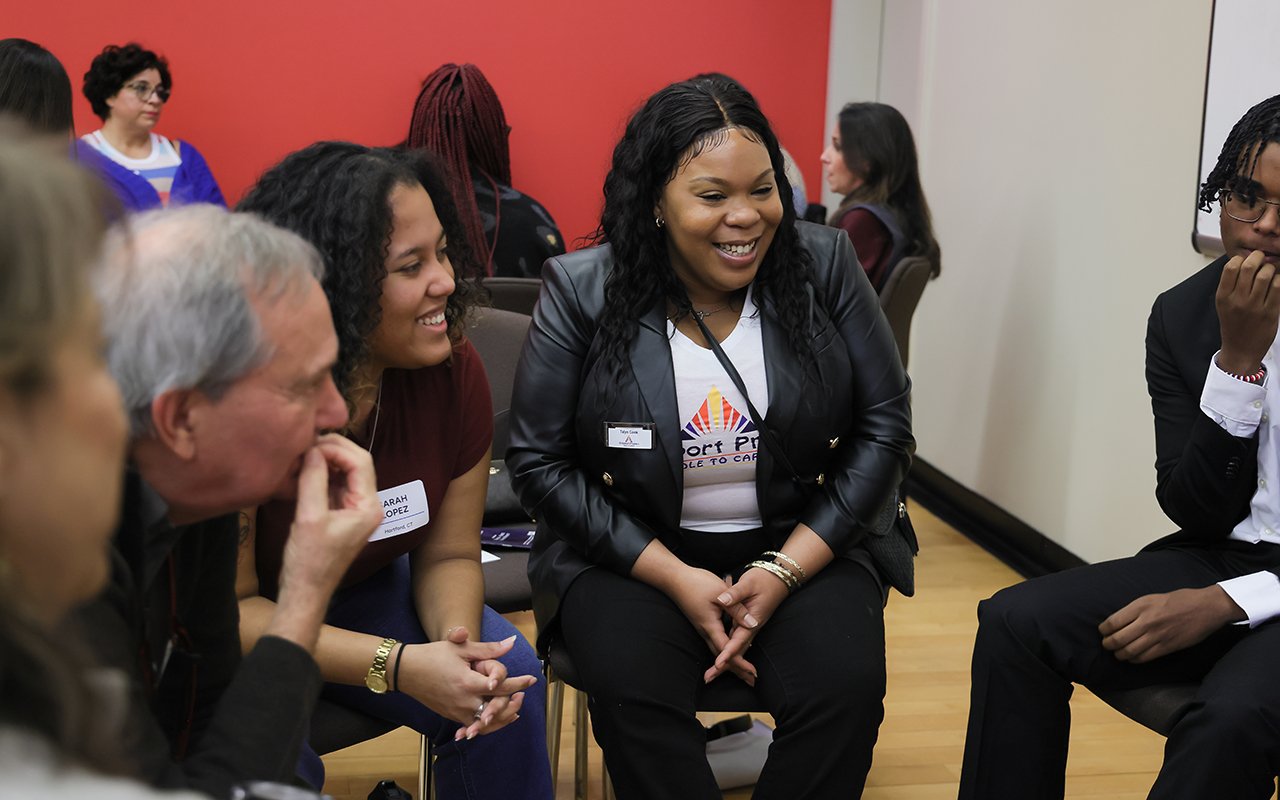 A group of attendees have a discussion during a breakout session at the State of the Student Conference