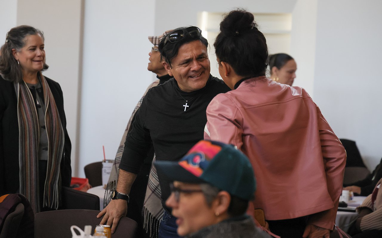 Attendees chat during the State of the Student Conference