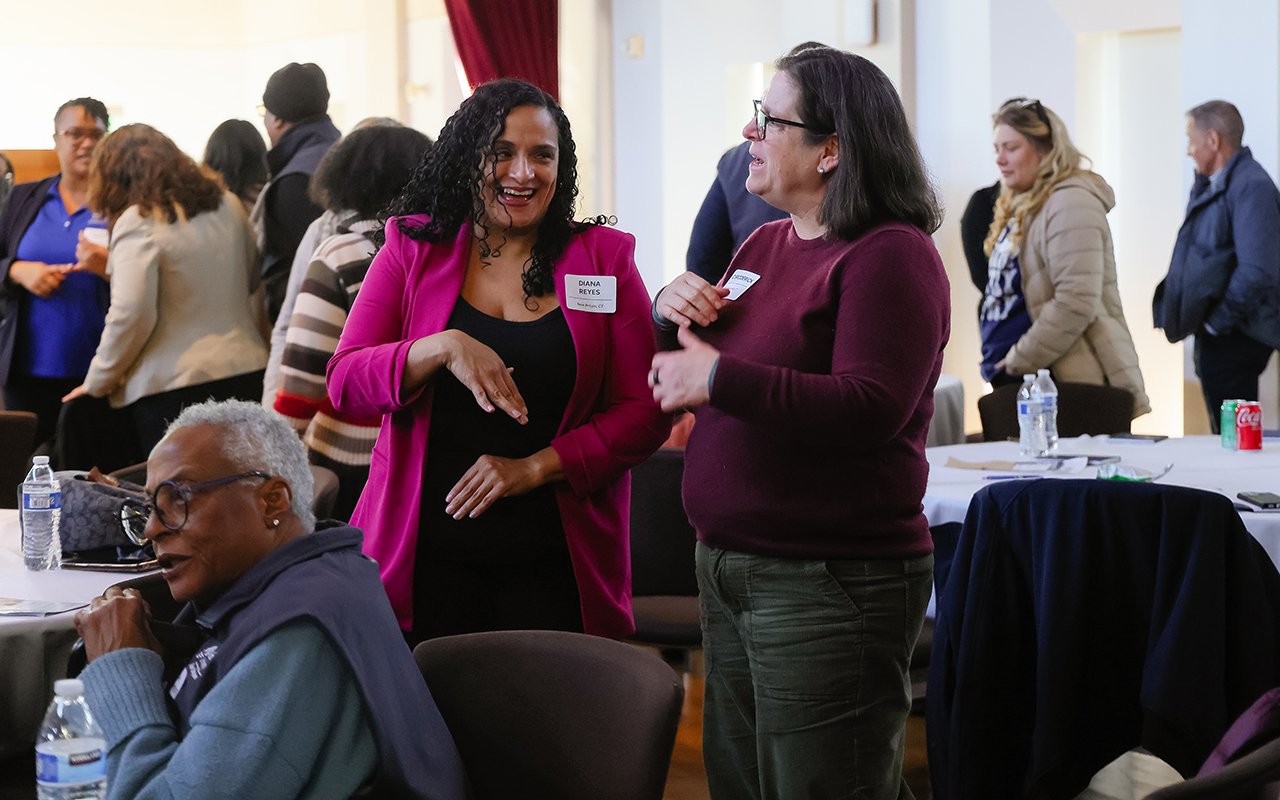 Attendees chat during the State of the Student Conference