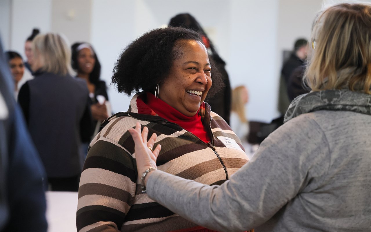 Attendees greet each other at the State of the Student Conference