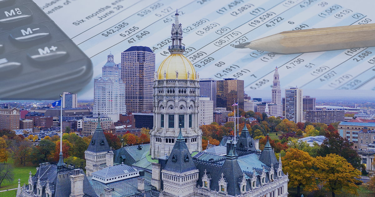 Image of Connecticut State Capitol and Hartford skyline and behind the skyline is a calculator and a budget page with a pencil on it.